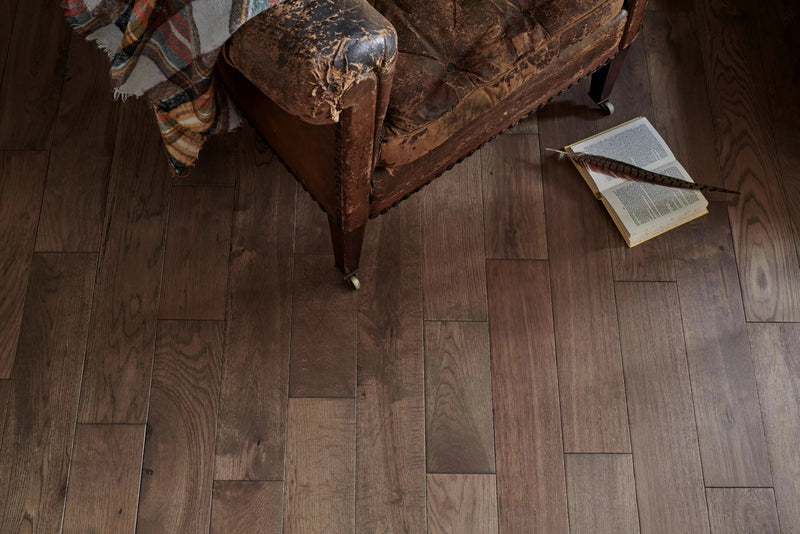 Dark brown engineered wood flooring planks featuring natural wood grain pattern and durable hardwood material