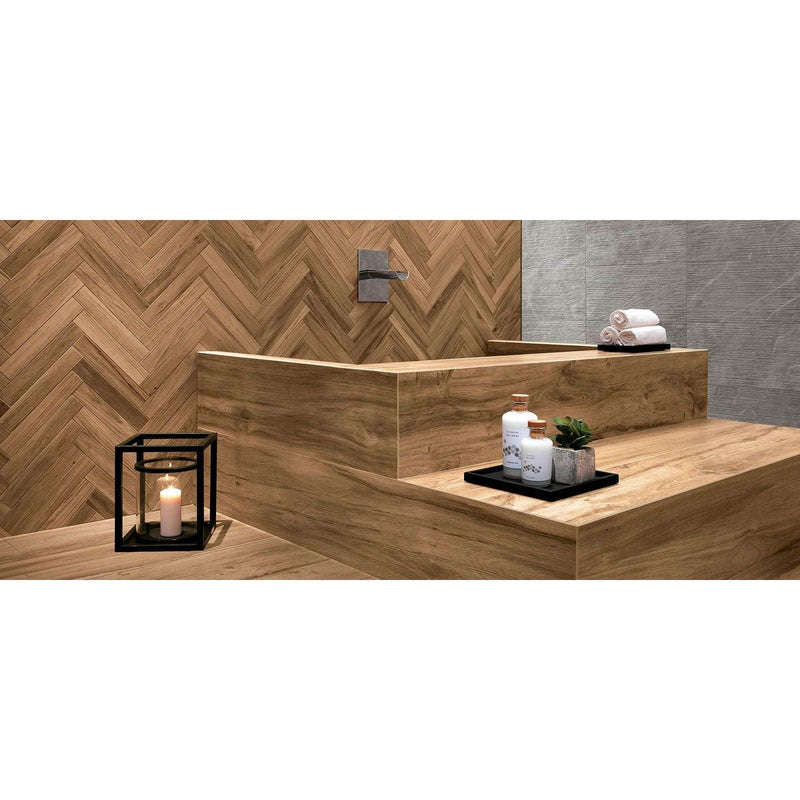 Modern wooden bathtub with integrated sink and herringbone tile backsplash in warm natural wood finish from Etic collection