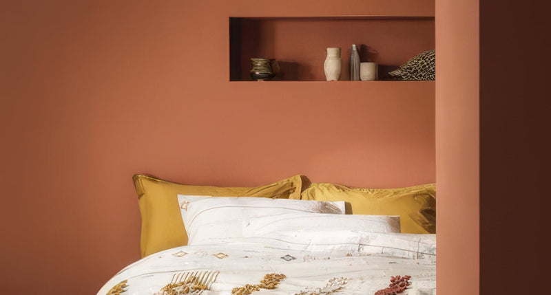 Yellow satin pillowcases with subtle geometric pattern from fired earth paint iconic colours and premium finishes collection