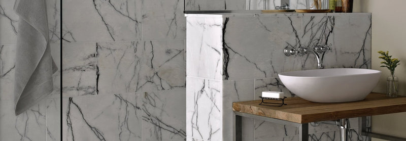 White ceramic vessel sink with sleek modern design featured in georgica pond tiles collection
