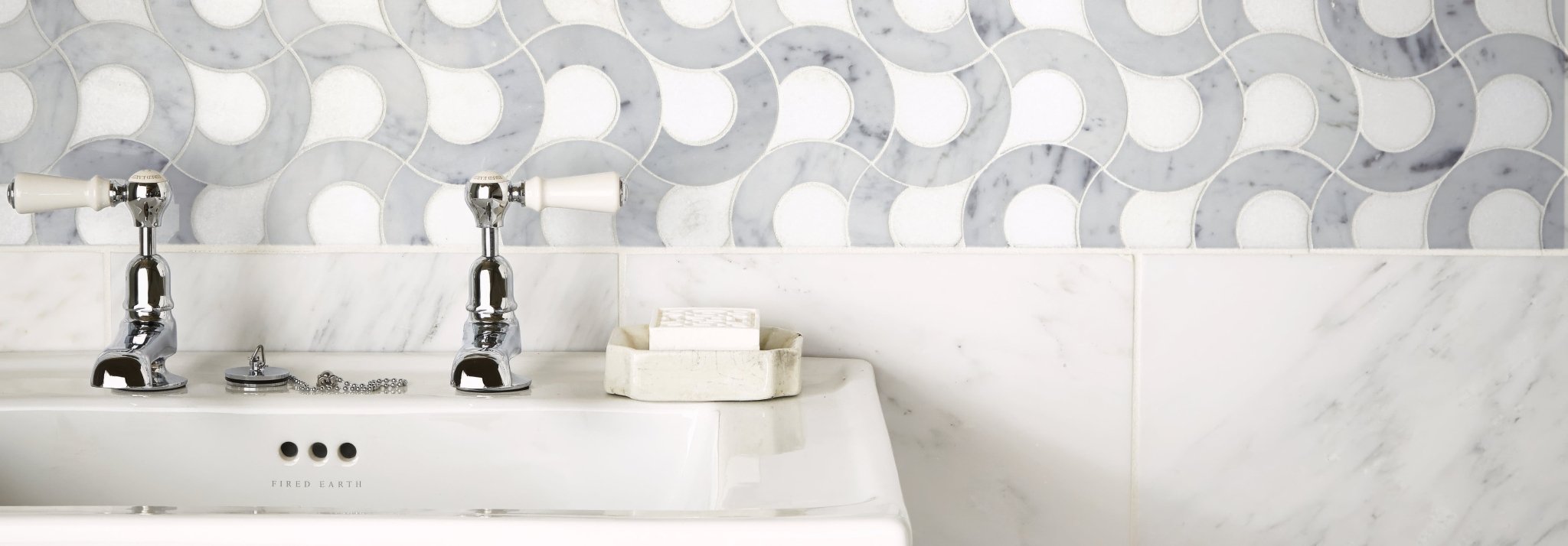 Chrome finished faucet with white ceramic handles from high society marble collection for elegant bathroom use