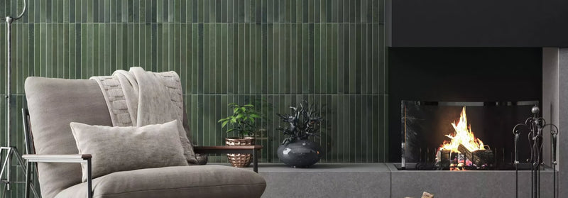 Gray upholstered armchair with metal frame and textured throw blanket from the ixworth tile collection
