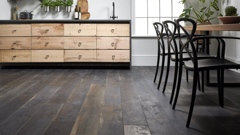 Dark gray kitchen engineered wood flooring with natural rustic finish and wood plank texture