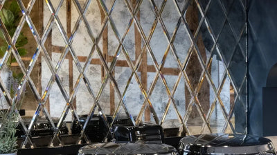 Shiny chrome diamond-patterned mirrored wall panel ideal for kitchen splashback decor and protection