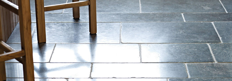 Dark gray slate kitchen stone floor tiles with subtle natural veining and a polished reflective surface