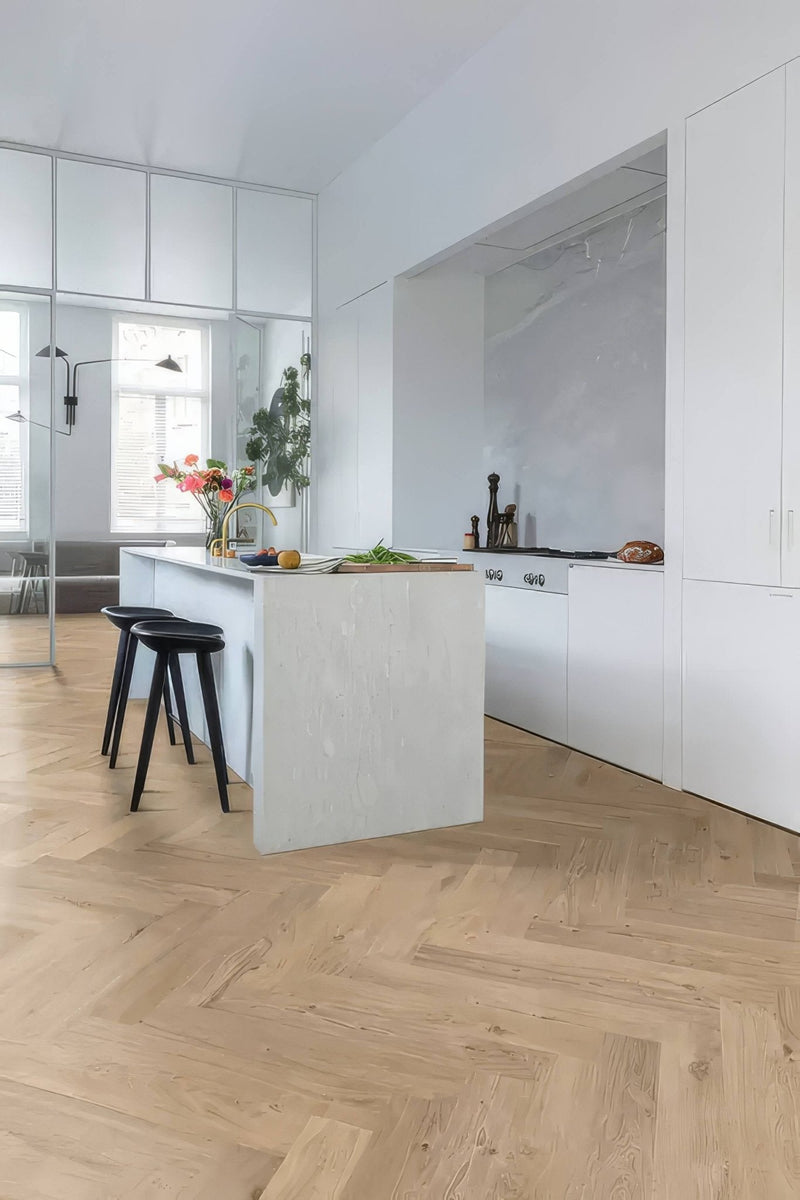 White kitchen island with smooth minimalist design and integrated countertop in kitchen vinyl flooring collection