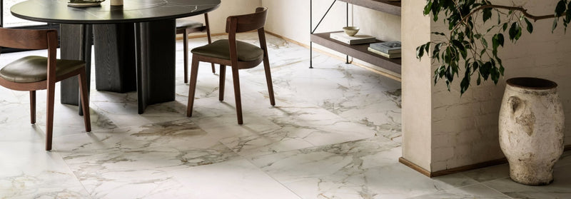 White marble floor tile with subtle gray veining from the lasa porcelain tiles collection