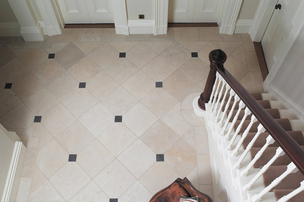 Beige and black diamond-patterned polished marble floor tiles from the limestone tiles collection