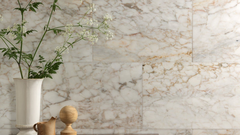 White marble wall tiles with subtle beige and gray veining perfect for elegant interior design walls