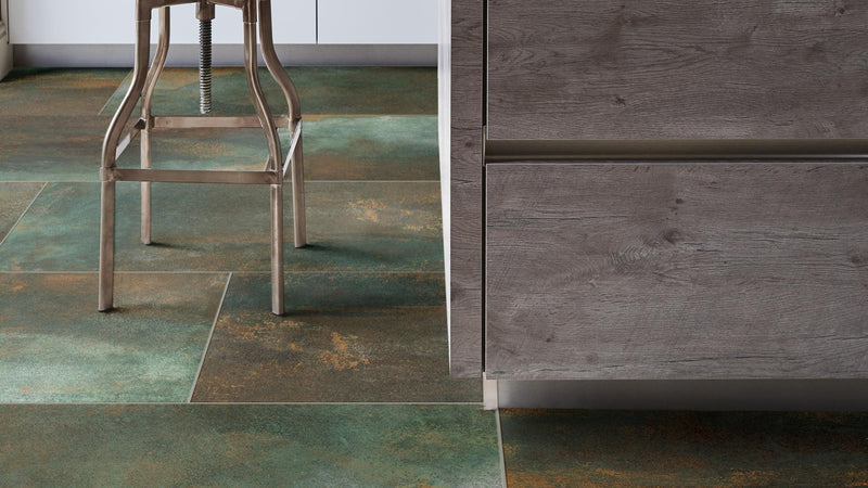 Dark green and brown textured stone tiles with a rustic weathered finish from the metal effect kitchen tiles collection