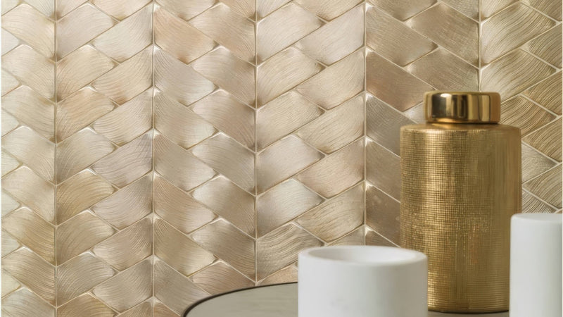 Gold-toned textured ceramic jar with matching lid showcasing metal effect wall tiles collection design