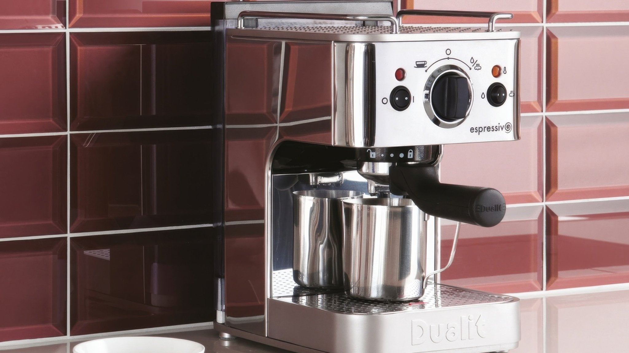 Stainless steel espresso machine with black handle and control dial featuring sleek modern design in metro wall tiles collection