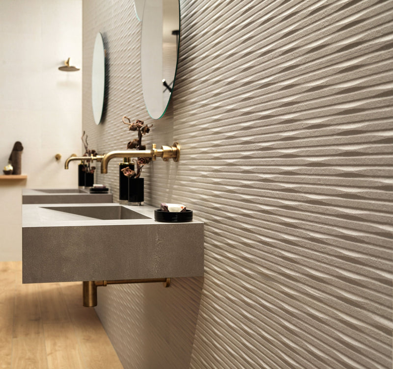 Modern concrete sink with integrated gold-toned faucet featuring minimalist design from minoli tiles contemporary collection