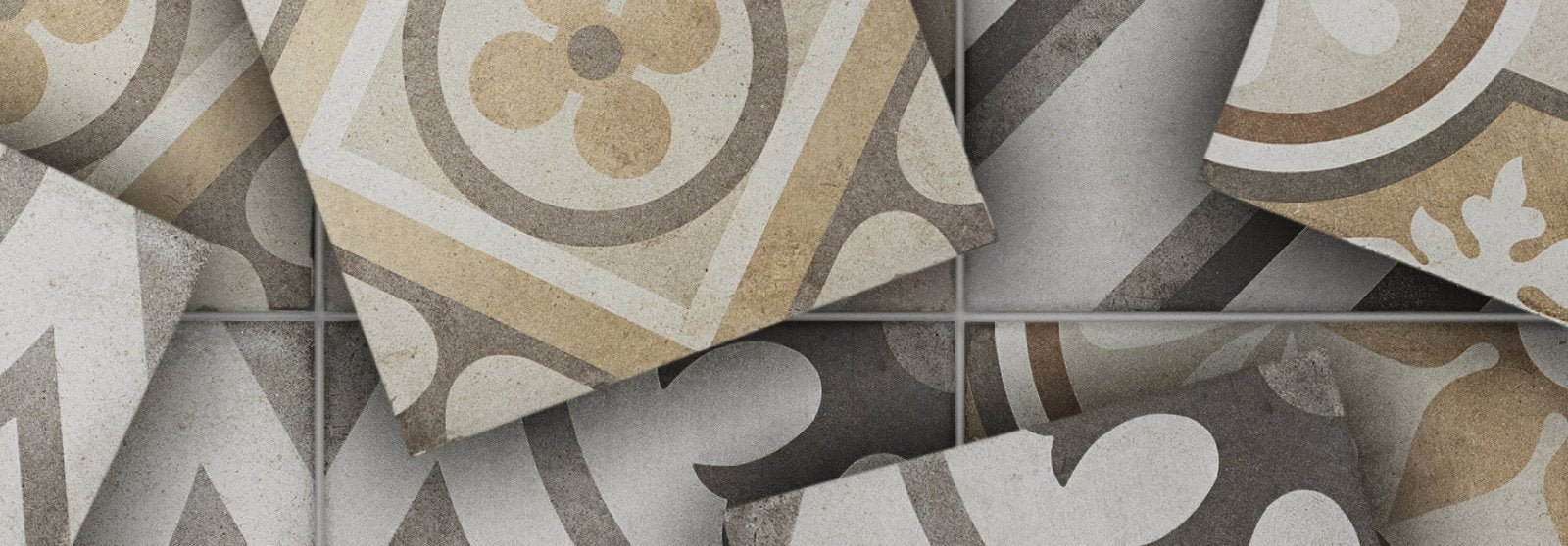 Patterned ceramic floor tiles in beige gray and cream with ornate circular and floral designs from naples tile collection