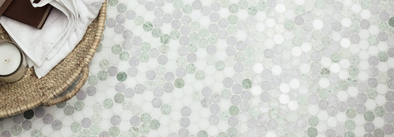 A mosaic tile floor with circular light gray and white marble-like tiles featuring subtle green veining from North Haven.