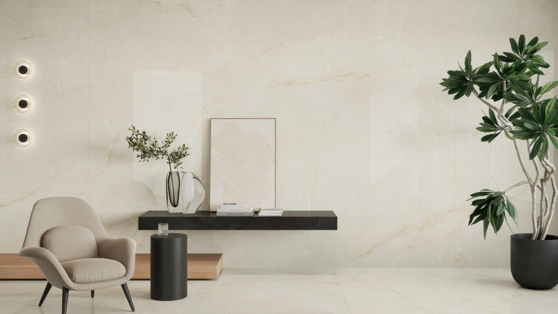 Minimalist black floating shelf with matte finish holding white vase and framed artwork on onyx effect wall tiles