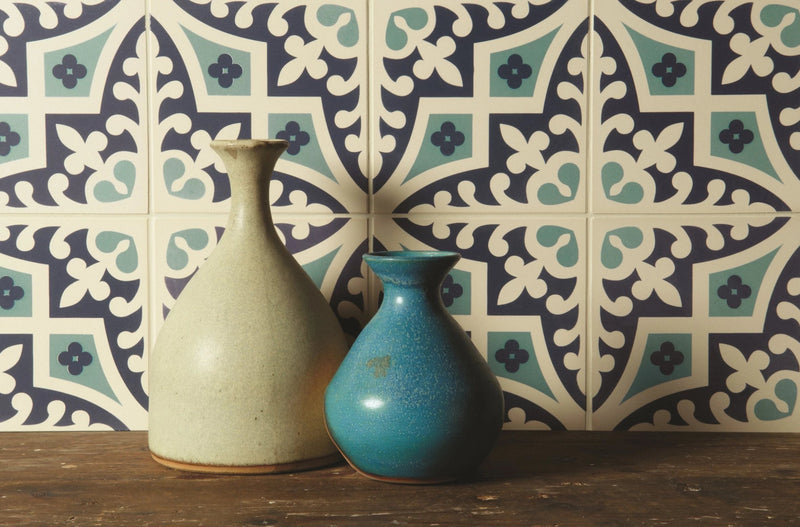 Two ceramic vases from original style odyssey tiles collection with matte off-white and turquoise speckled finishes
