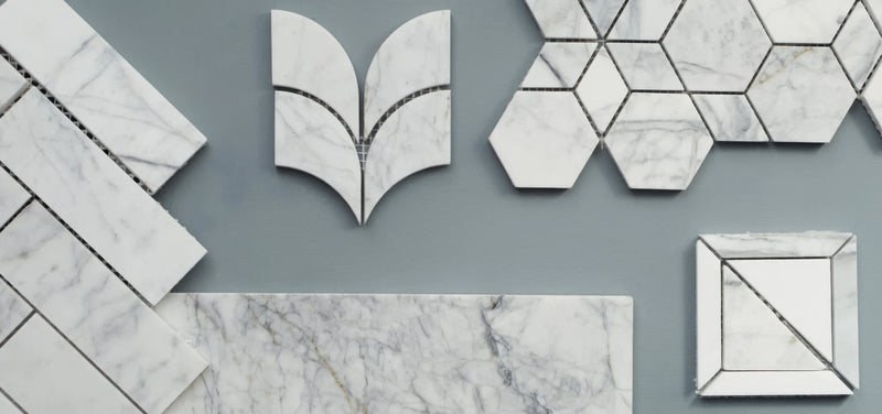 White marble mosaic tiles in geometric patterns from the ottimo marble tile collection for elegant wall and floor design