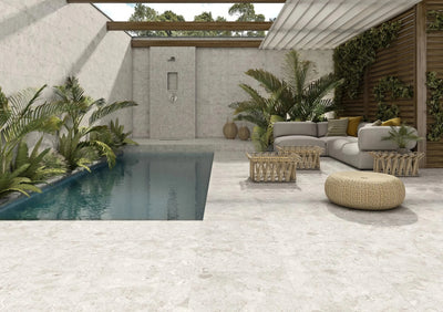 Light gray outdoor porcelain tiles with subtle natural veining and a matte finish stone patio tiles