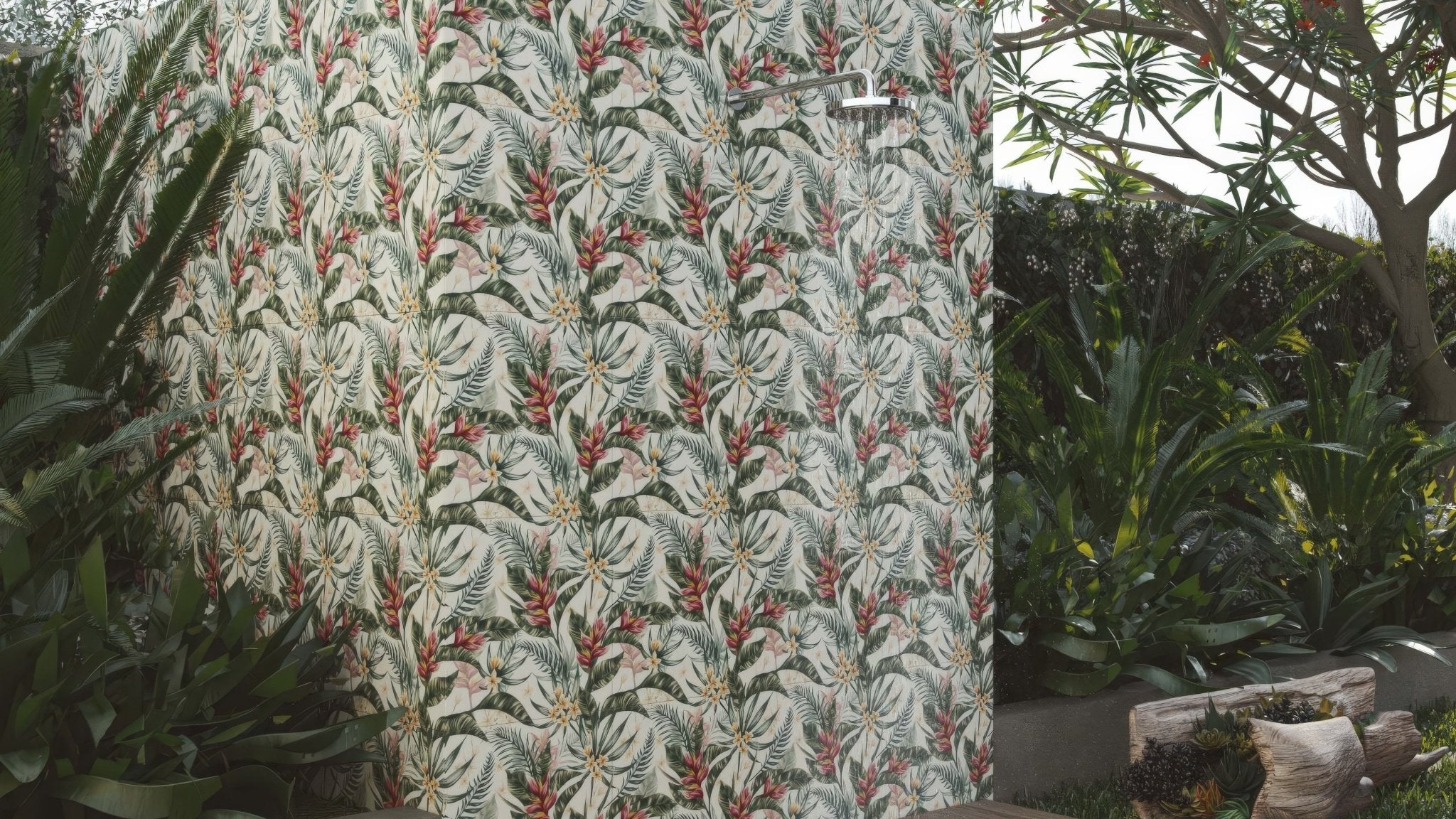Tropical-patterned outdoor shower enclosure with white green and red foliage on off-white outdoor wall tiles