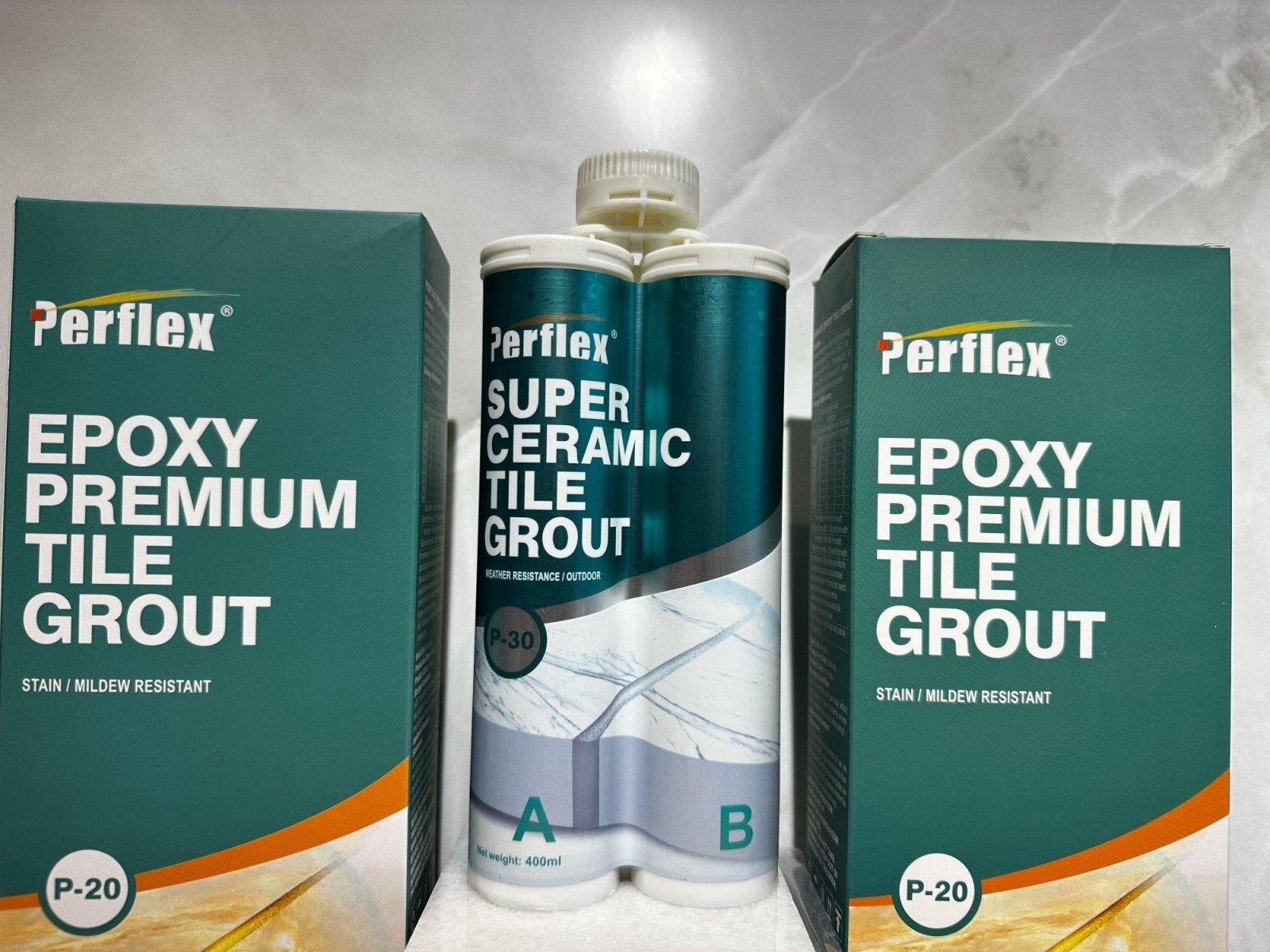 Perflex super ceramic tile grout in a teal and white dual-component tube for outdoor use from Perflex epoxy grout collection