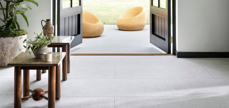 Woven wicker lounge chairs in natural light beige with rounded organic design from piazza tiles collection