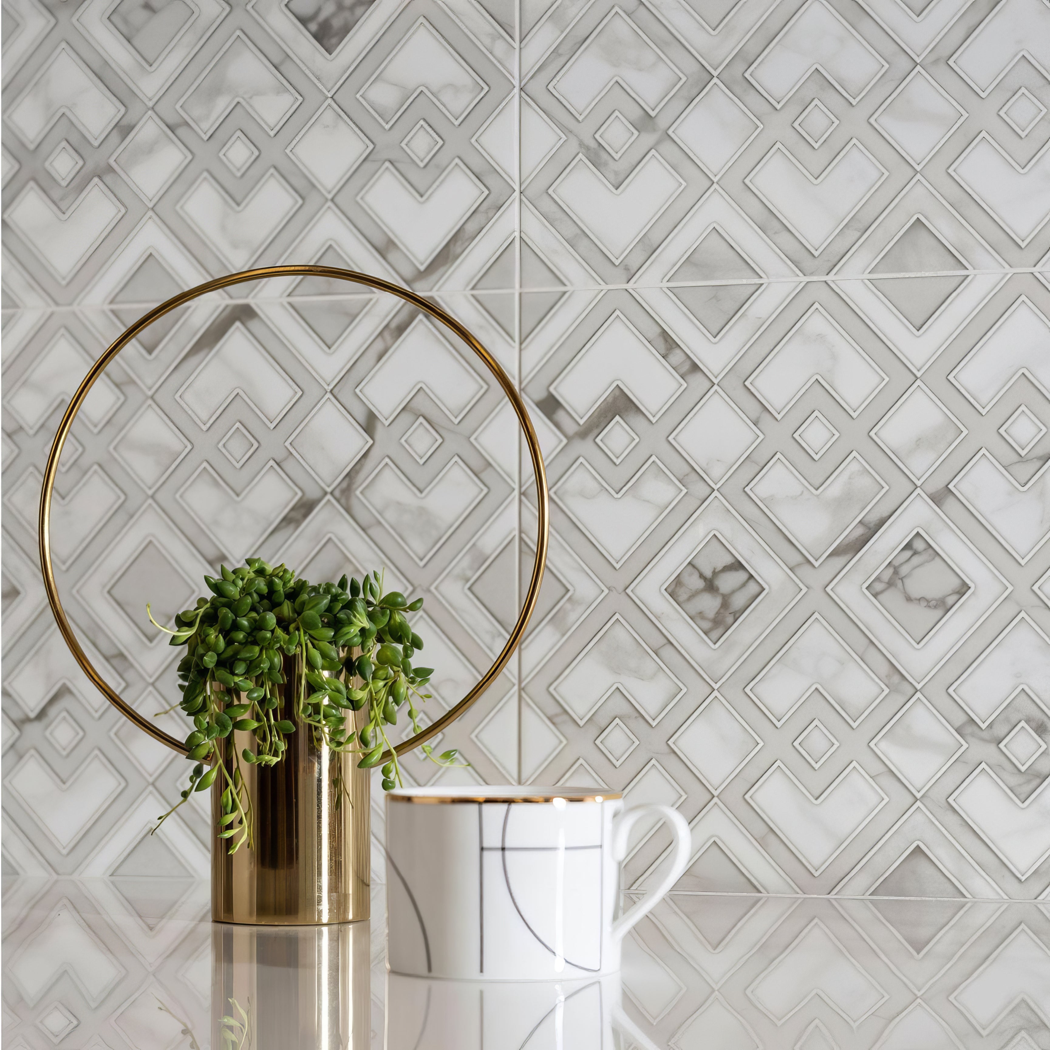 Gold cylindrical planter with circular gold ring and green trailing plant from palazzo collection