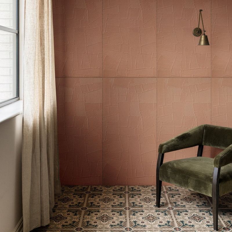 Olive green velvet armchair with dark wooden legs from the plastercraft porcelain collection