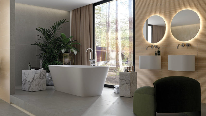 Free-standing white porcelain bathtub with sleek modern design and minimalist curves in porcelain wall tiles collection