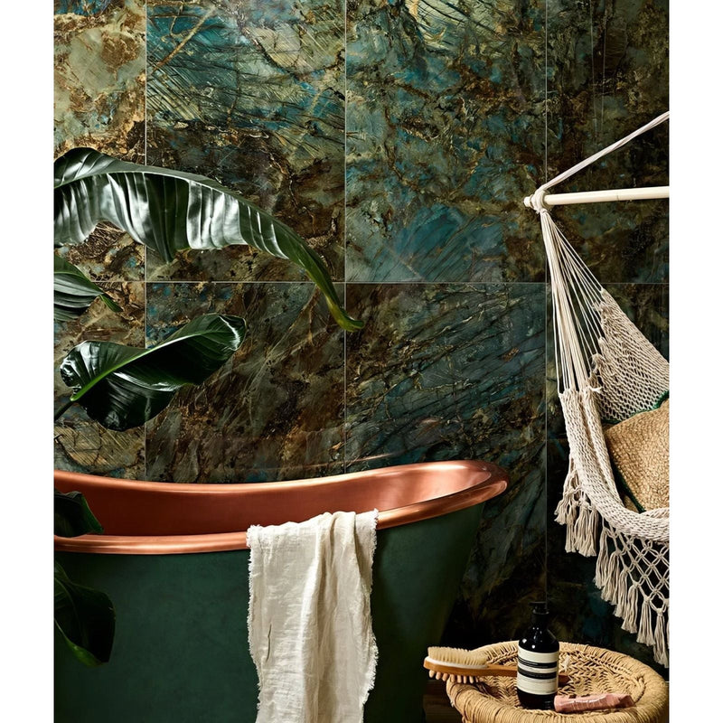 Copper bathtub with matte green exterior and polished copper rim from the rainforest porcelain collection