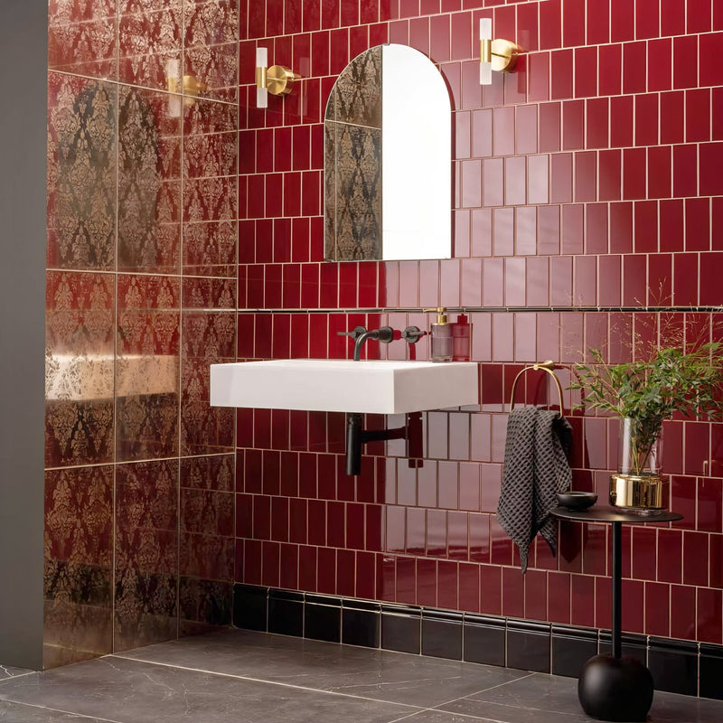 White rectangular wall-mounted sink with black faucet and chrome fixtures in red tiles collection bathroom setting
