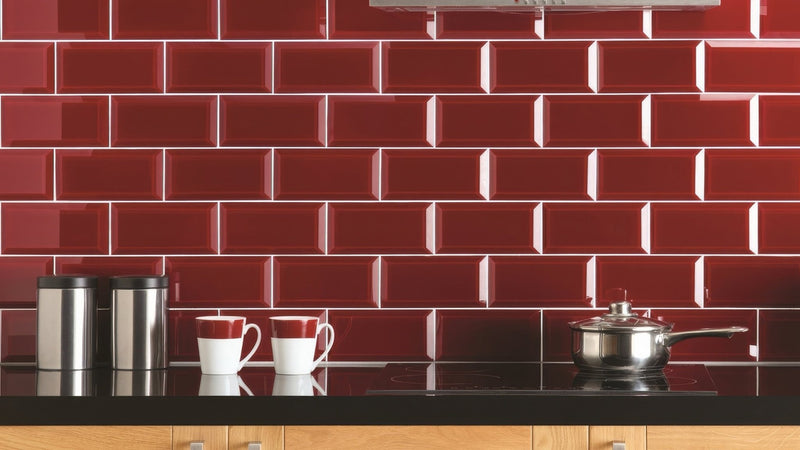 Red glossy subway tile backsplash showcasing vibrant red wall tiles for kitchen or bathroom decor