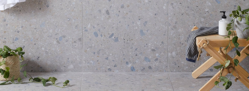 Gray terrazzo tile with blue and white speckles in the reykjavik collection for flooring and walls