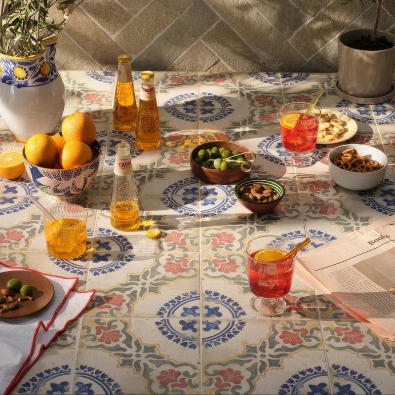 Patterned ceramic tile table with floral and geometric blue pink green and cream designs from Sardinia Porcelain collection