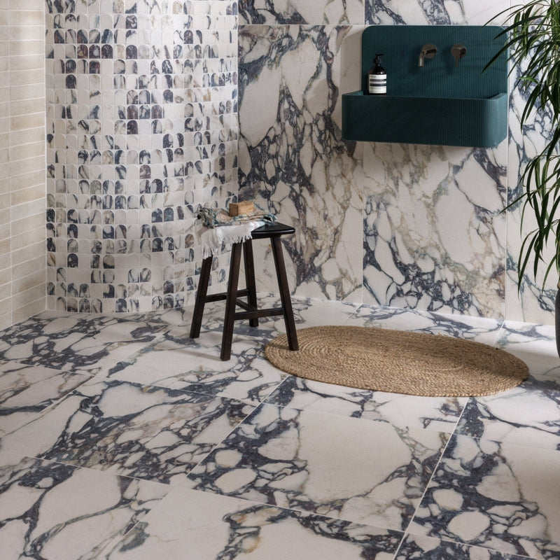 The savoy novo porcelain bathroom tiles feature elegant white and dark gray marble-patterned floor tiles with a subtle sheen
