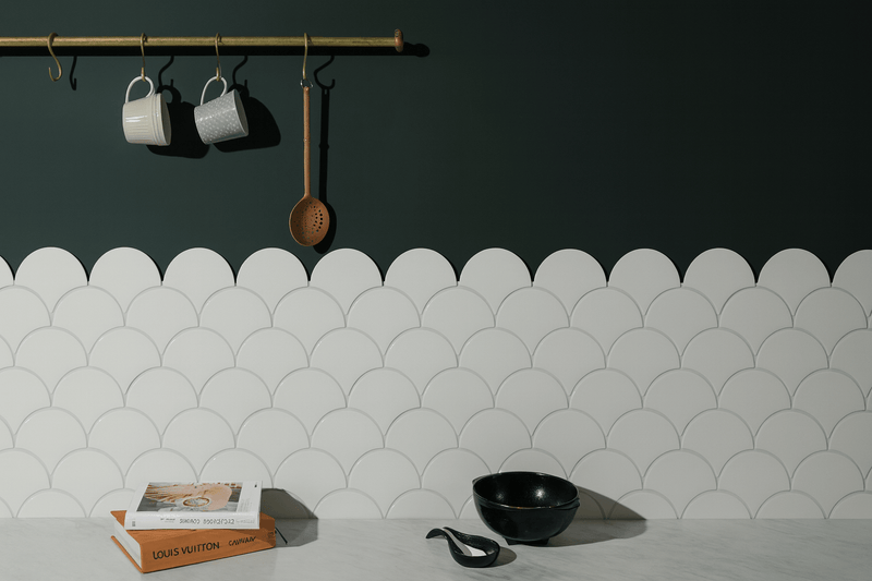 White scalloped tile backsplash with subtle matte finish from the scallop wall tiles collection
