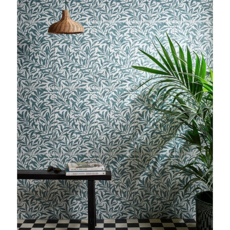 Teal and white leaf-patterned ceramic wall tiles from the silk screen ceramic collection for decorative use