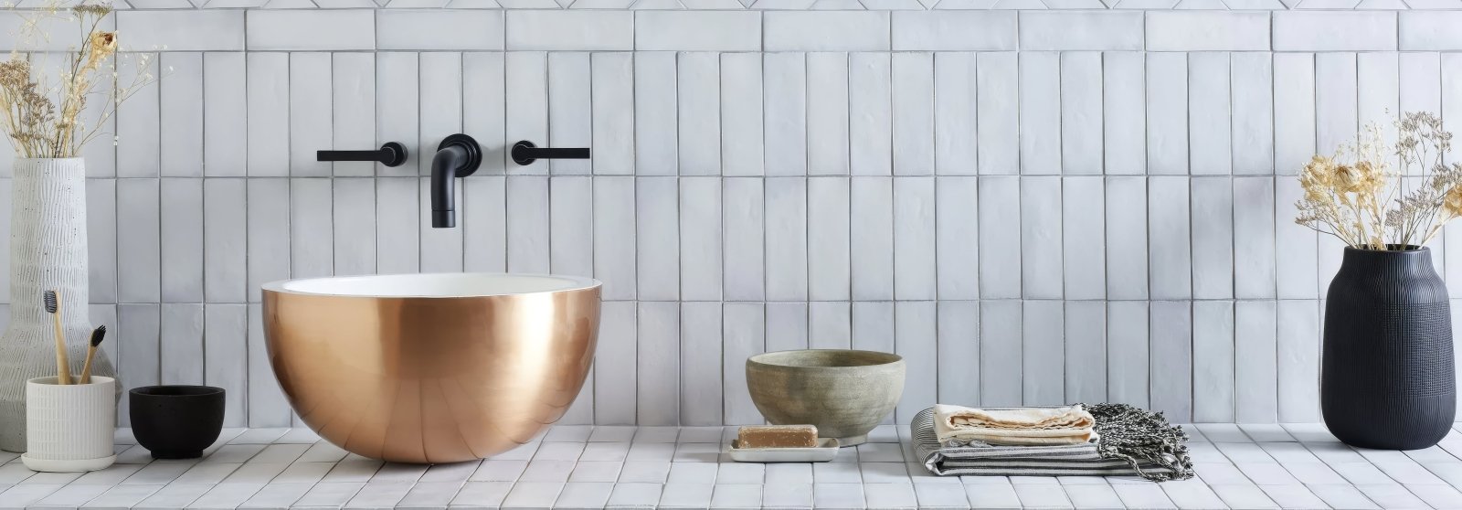 Copper-finished round vessel sink with sleek modern design from the South Cliff Tiles collection.