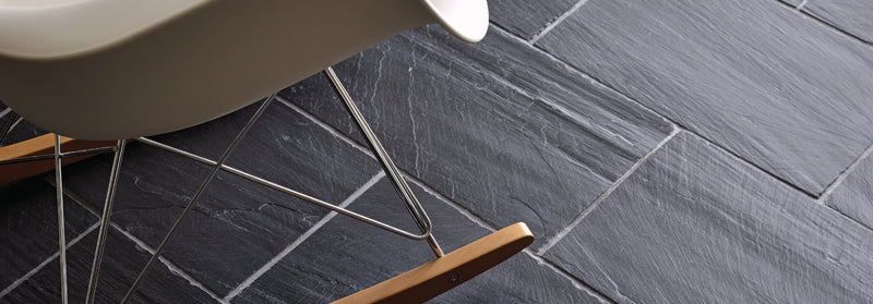 Dark gray spanish black slate tiles with natural textured surface and subtle white grout lines