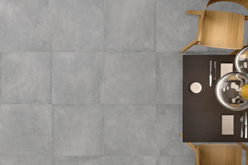 Gray concrete-effect square floor tiles showcasing modern durable flooring options for residential and commercial spaces