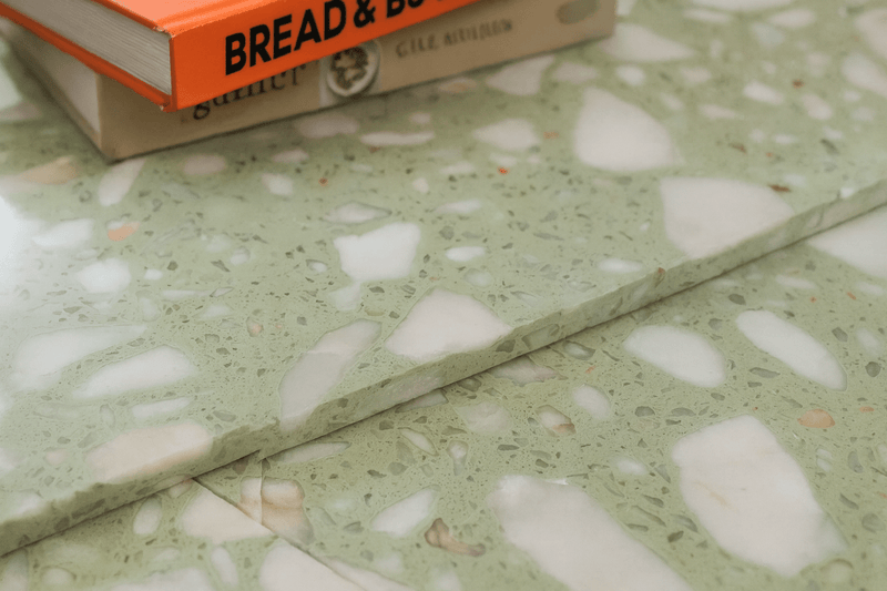 Light green terrazzo countertop with white and speckled aggregate in terrazzo floor tiles collection