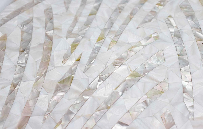 A delicate iridescent mother of pearl mosaic tile arranged in flowing diagonal stripes from The Seasons Collection