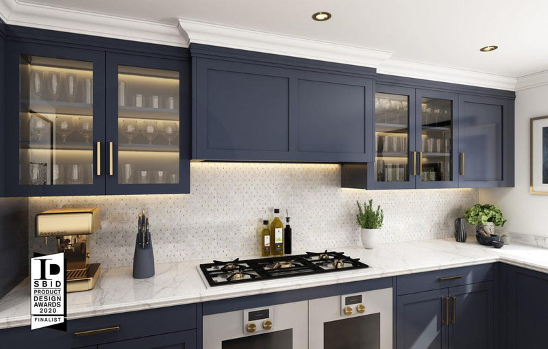 Navy blue shaker-style kitchen cabinets with glass-front upper doors and gold-toned hardware from The Signature Collection