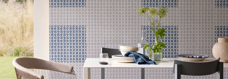 Blue and white patterned ceramic wall tiles from the Tricia Guild tile collection for decorative use