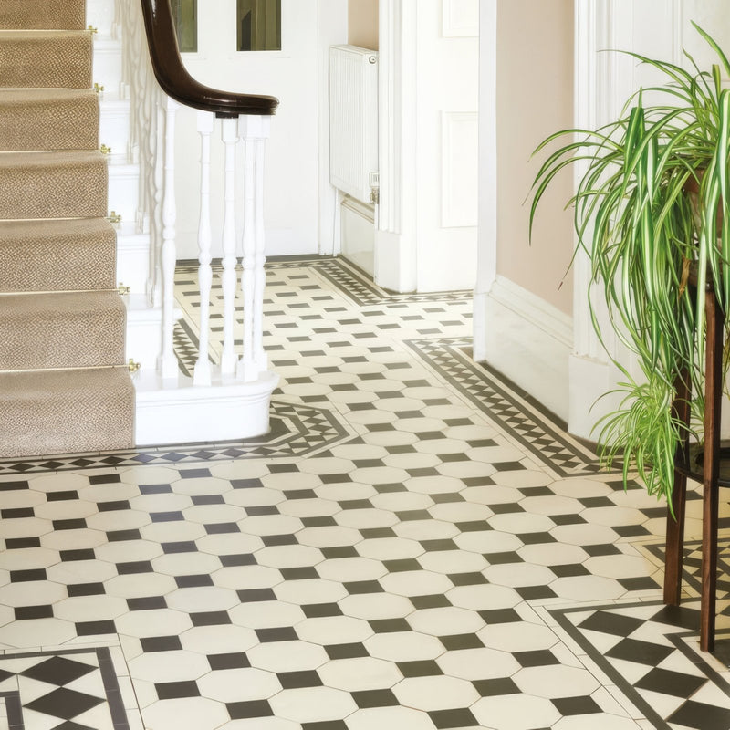 Black and white hexagonal Victorian floor tiles with a geometric Chesterfield pattern for decorative flooring