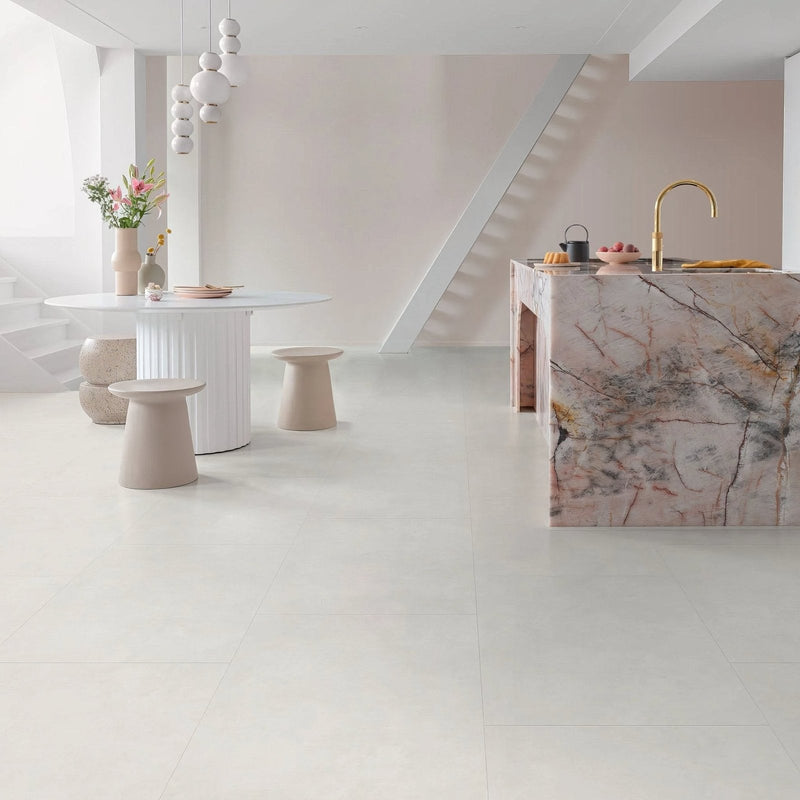 Marble kitchen island with pink and gray veining featured in vinyl tile flooring collection for modern kitchens