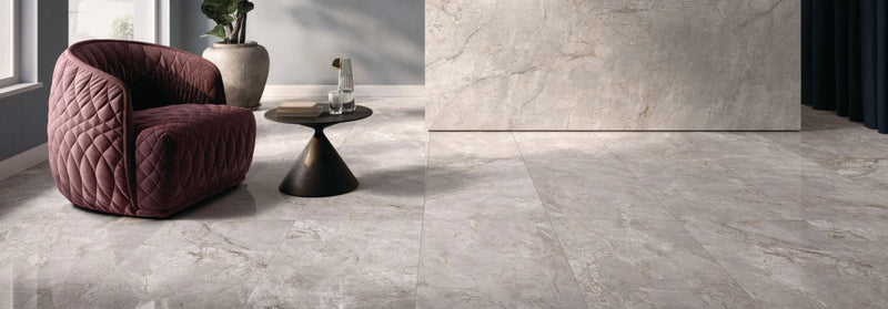 Quartzite gray marble floor tiles with subtle veining and polished reflective surface from Volterra Tiles collection