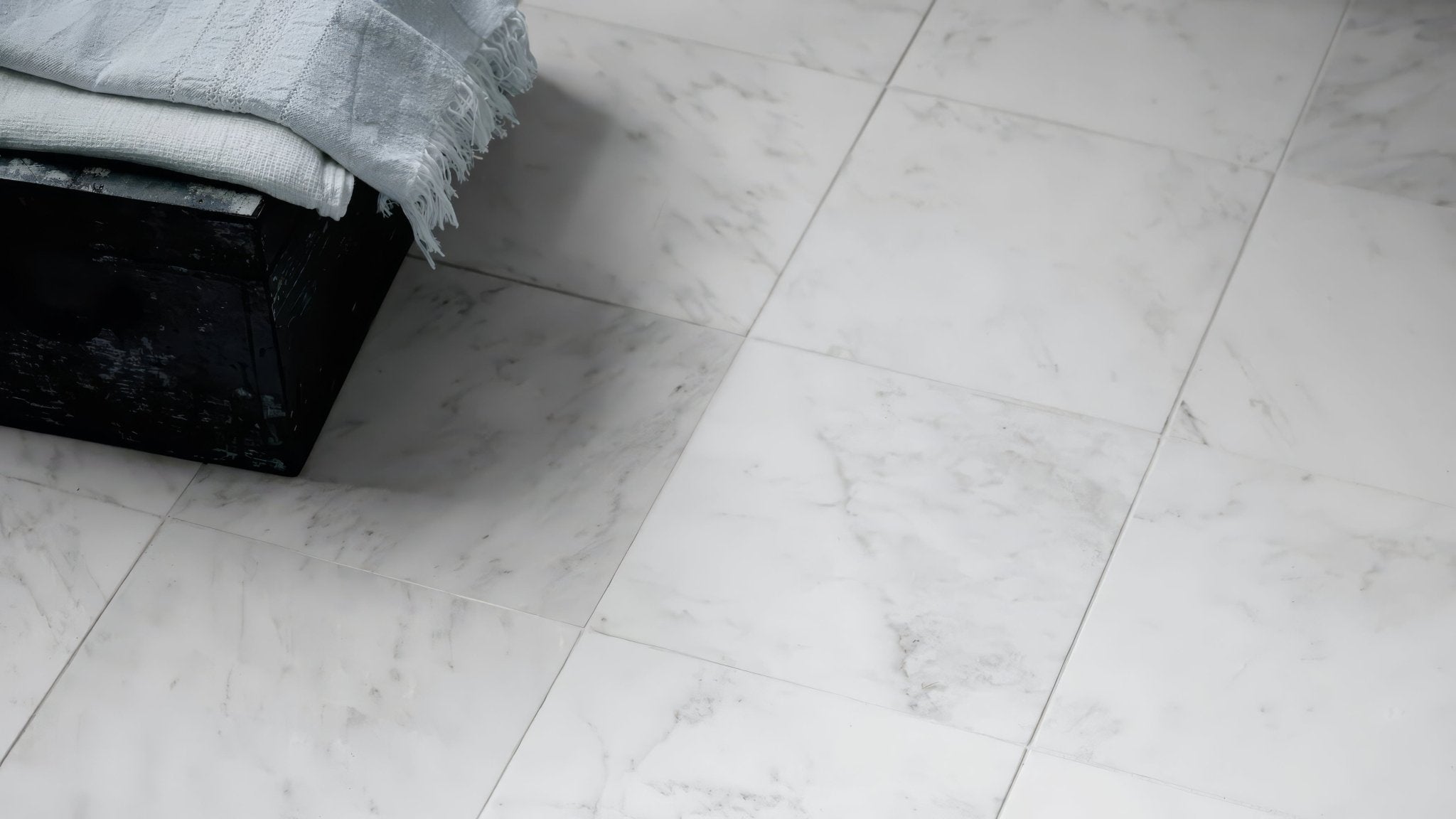 White kitchen tiles featuring white marble floor tiles with subtle gray veining for elegant flooring options