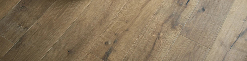 Warm-toned engineered oak hardwood floor planks with natural grain and subtle knots from woodpecker dartmouth collection