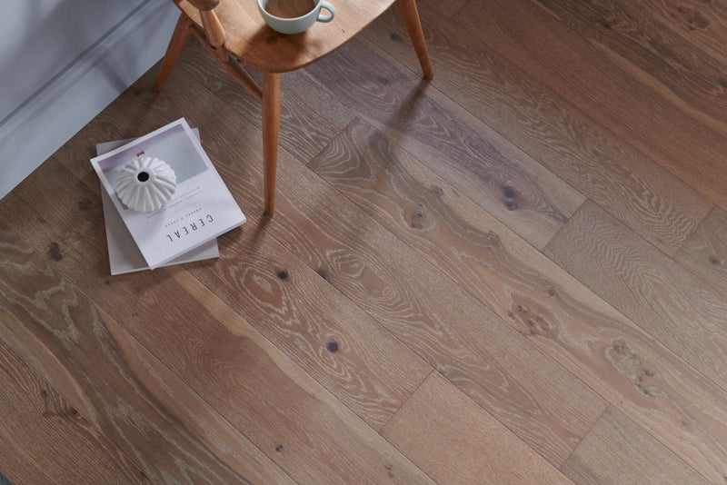 Warm-toned hardwood floor with natural wood grain and subtle knots from Woodpecker Lynton flooring collection.